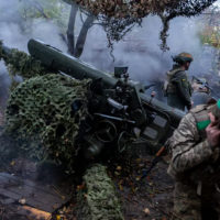 Ukrainian servicemen of Khartia brigade fire D-30 Howitzer towards Russian positions in Kharkiv region, Ukraine, Wednesday, Oct. 16, 2024. Photo: Alex Babenko/AP